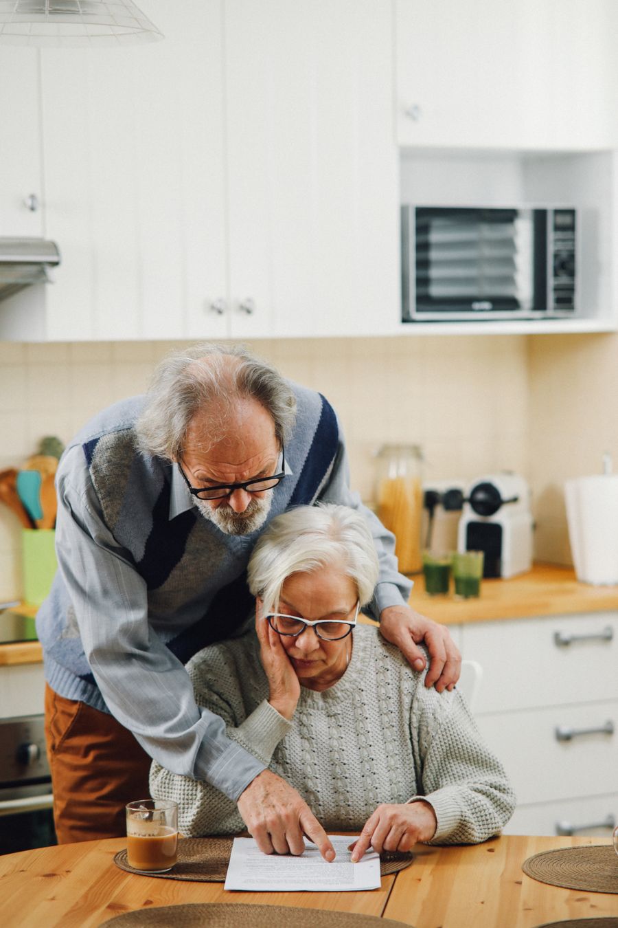 A senior couple reviewing care and payment options together